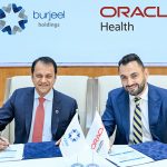Mr. John Sunil, CEO, Burjeel Holdings (L) and Mr. Alaa Adel, Senior Vice President, and Managing Director - International, Oracle Health, (R) signing the agreement during a ceremony at Burjeel Medical City